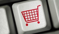 � Fotolia/Martin Fally, Eine Keyboardtaste mit einem Einkaufswagensymbol